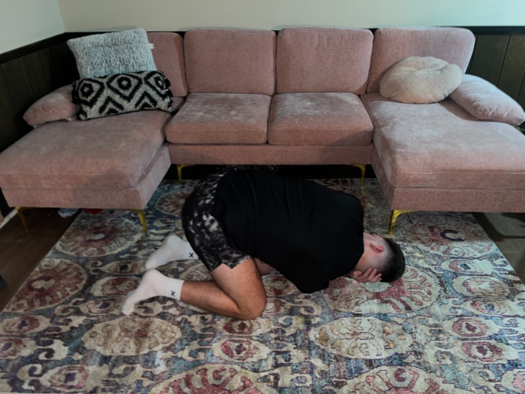 Man demonstrating a T-spine stretch.