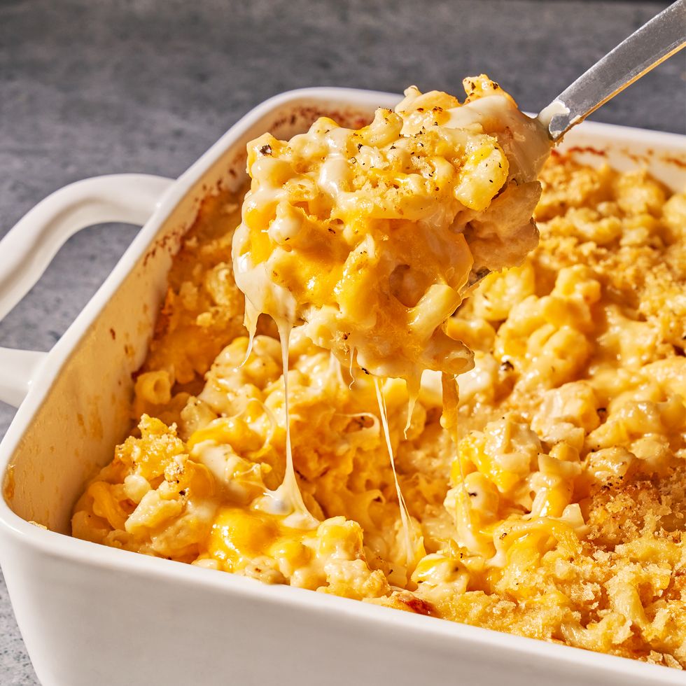 Decadent and gooey Mac and Cheese in a white baking dish