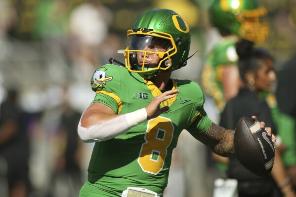 Dillon Gabriel warming up before a game vs Idaho