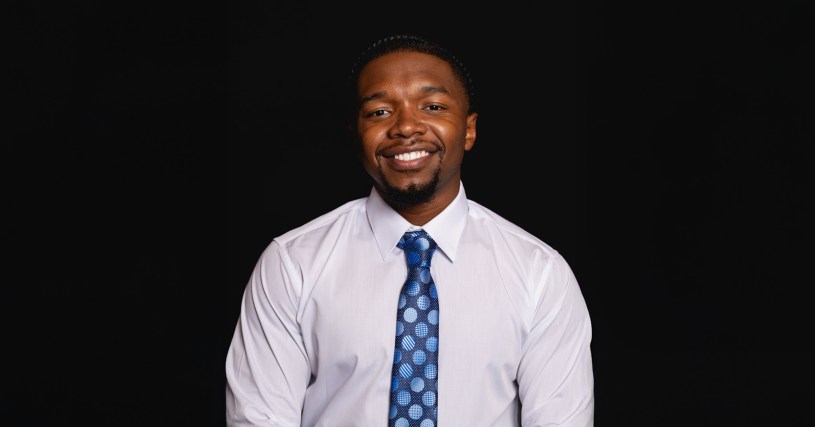 Man in front of black background