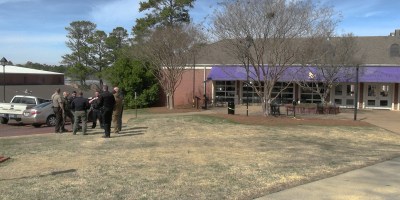 Police gather outside of Farmer hall