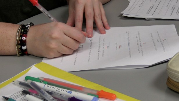 Student producer marks up a film script