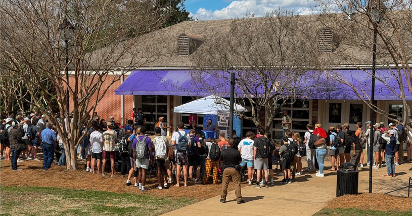 Group of people gathered outside of Farmer Hall