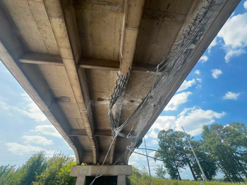 underside of interstate bridge damaged after being hit by equipment