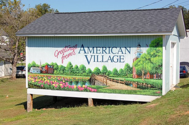 painted out house of landscape with bridge and flowers
