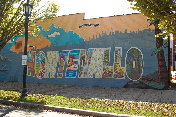 painted side wall of word Montevallo with imagery in letters