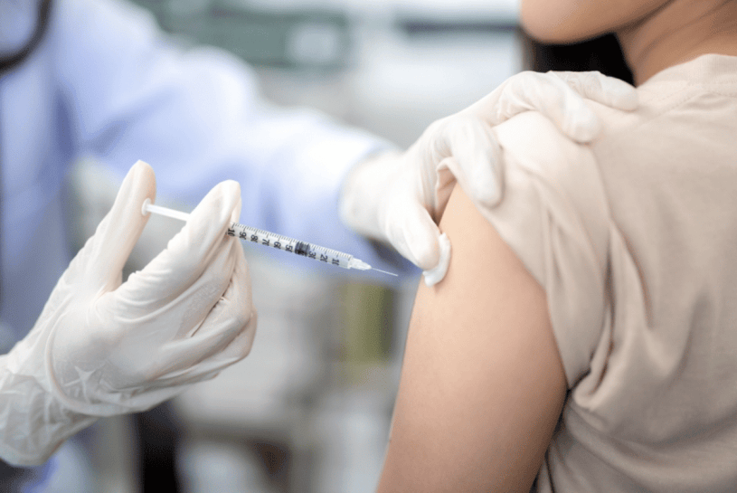 a woman getting her flu shot