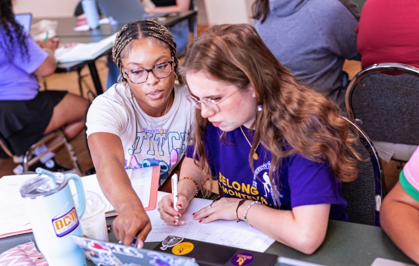two girls studying